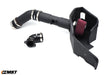 An automotive air intake system featuring a black plastic housing, red air filter, and connecting hoses for improved engine performance.